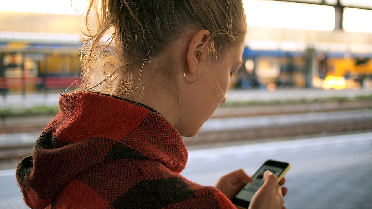 A person checking a smartphone